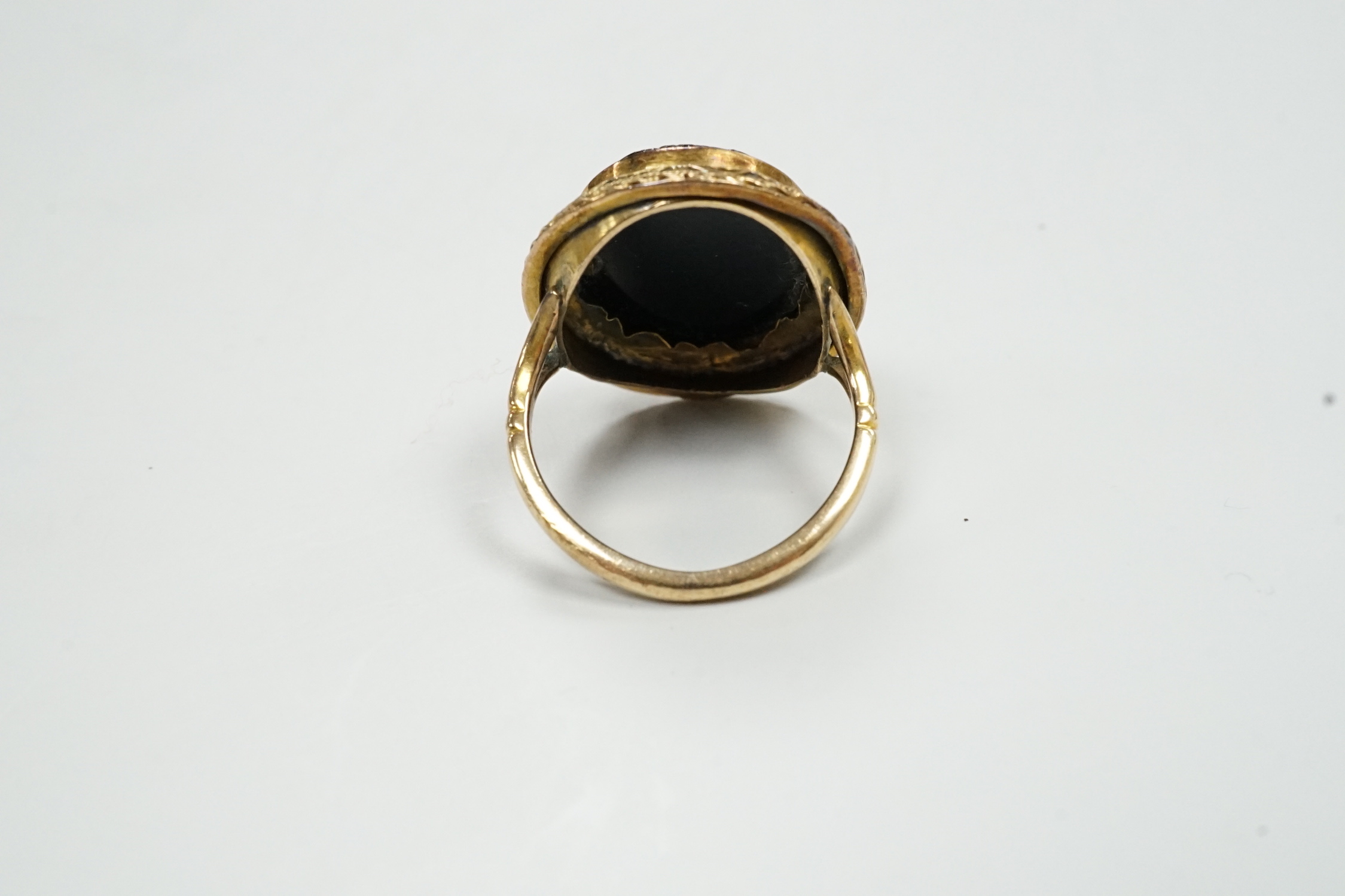 A 19th century yellow metal and micro mosaic set oval ring, size O, gross weight 5.9 grams.